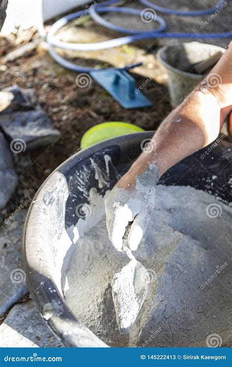 Male Hand Mixing Cement, Construction Site Stock Image - Image of build ...