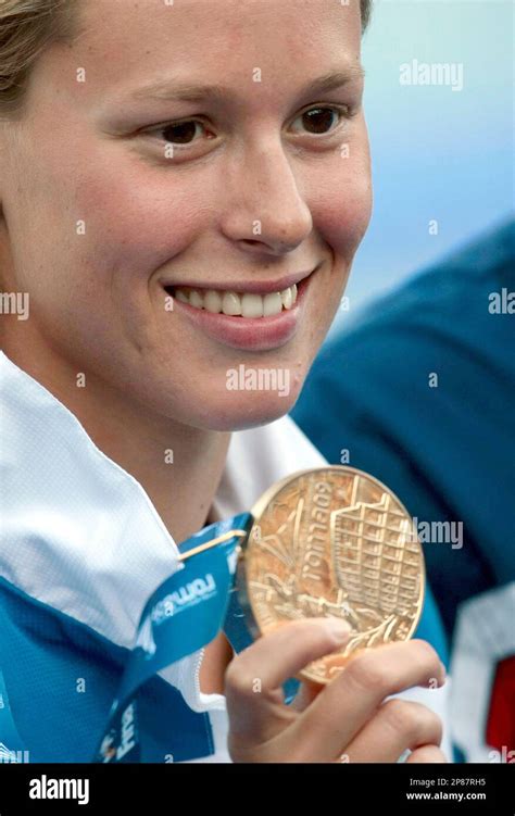 Italy's Federica Pellegrini shows her gold medal of the Women's 200m ...