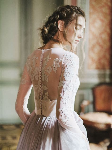Lilac wedding gown with long sheer sleeve and floral appliques floating