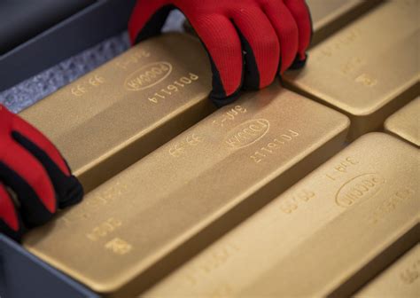 Gold rises on weaker dollar, trade war fears after Trump tariffs | Reuters