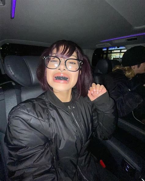 welcome | Molly Santana’s black grills are a reference to blackened