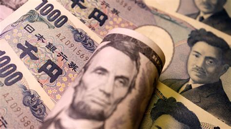 Yen jumps to 2-week high against dollar as BOJ weighs policy change ...