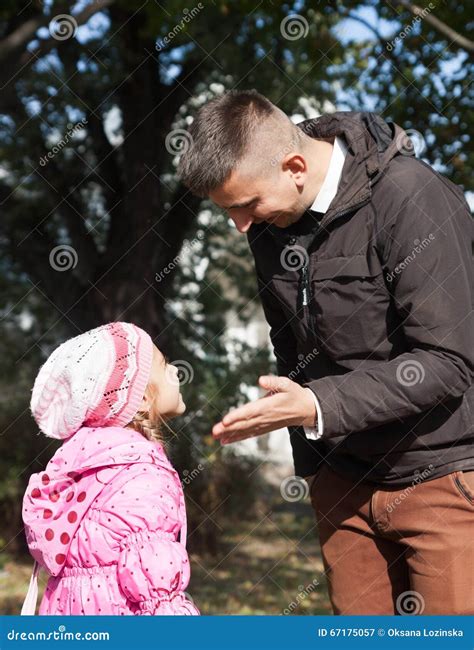 Dad teaches his daughter stock image. Image of behavior - 67175057