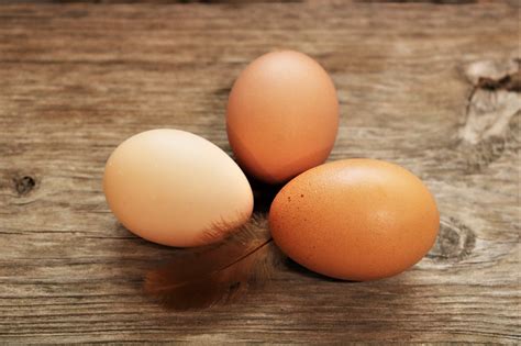 Three Brown Eggs On Wood Table Free Stock Photo - Public Domain Pictures