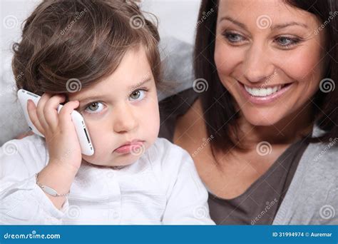 Mother and Daughter with Telephone Stock Photo - Image of happiness ...