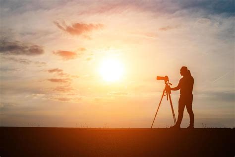 Silhouette of a photographer shooting at sunset 1920252 Stock Photo at ...