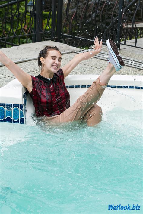 Wetlook sexy girl in office clothes swimming in Pool : r/WetlookGirls