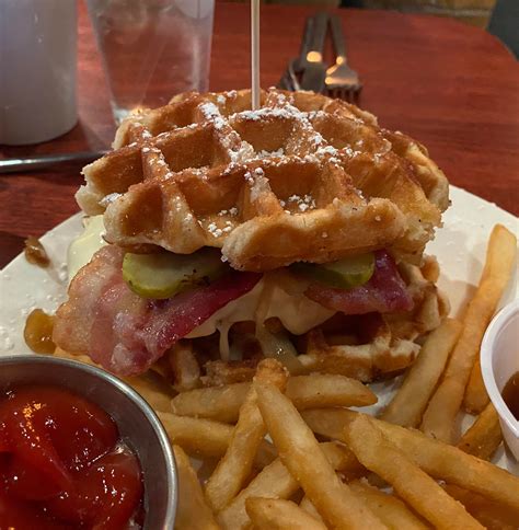 Buttermilk fried chicken waffle sandwich with onion marmalade, dill