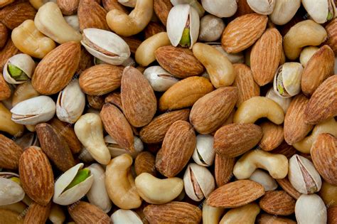 premium photo mixed nut background cashews almonds  pistachios