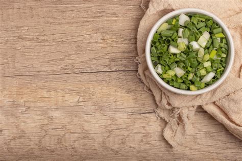 Sliced spring onions in a white cup 17340894 Stock Photo at Vecteezy