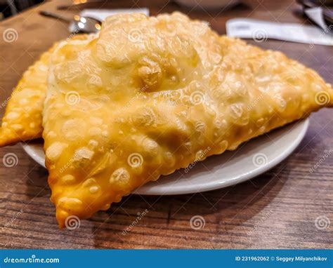 A Traditional Dish of Crimean Cuisine is Chebureks. Meat Filling in ...