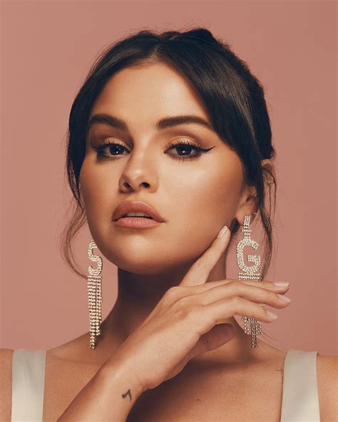 selena gomezs retrofete initial earrings  super gorgeous