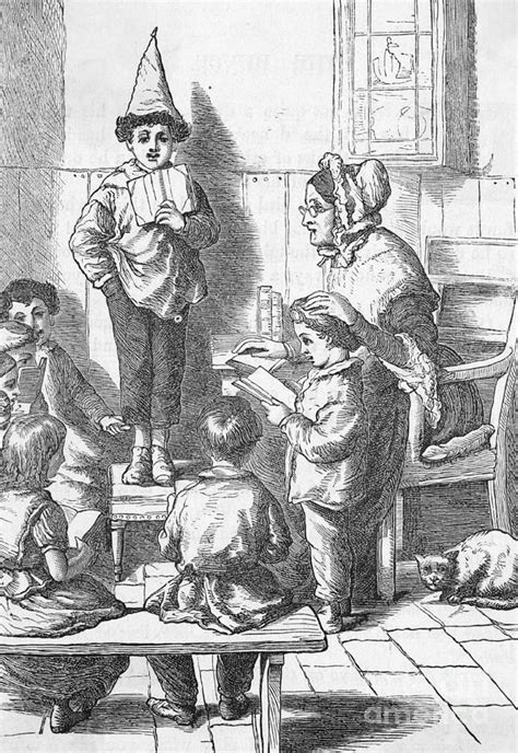 Boy Wearing Dunce Cap In Classroom Photograph by Bettmann - Fine Art ...