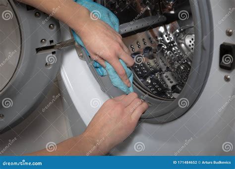 cleaning  loading white washing machine stock photo image  door