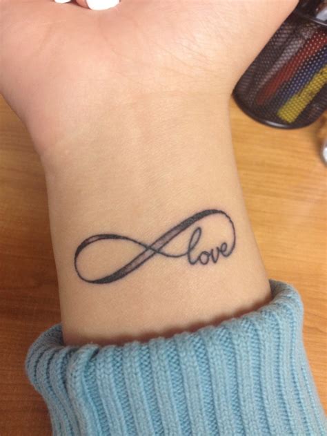 My first tattoo. Infinite love, love never fails.