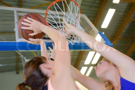 Playing indoor basketball | Stock image | Colourbox