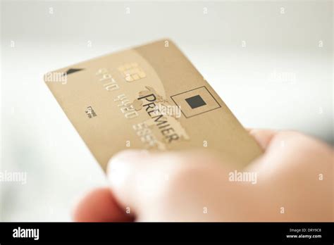 Hand holding credit card Stock Photo - Alamy