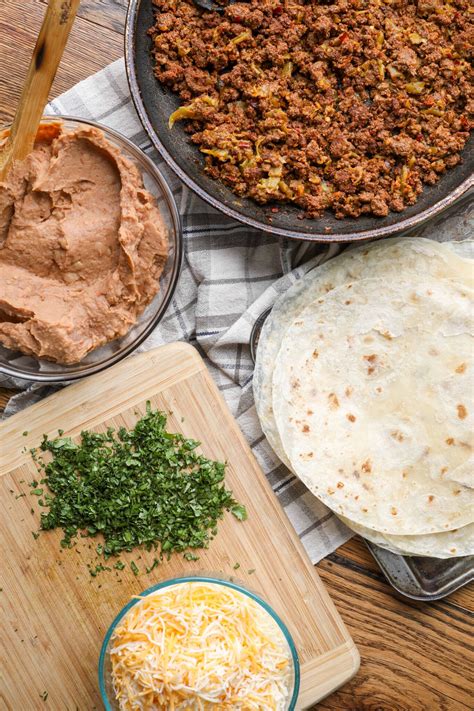 cheesy beef  bean burritos barefeet   kitchen