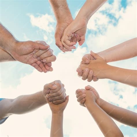 premium photo joined hands   team business teamwork close  group