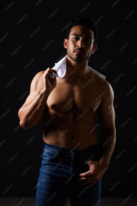 Premium Photo | Sexy muscle and portrait of man in studio with fitness