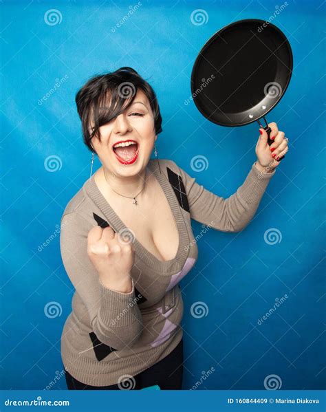 Woman Beating with a Frying Pan on Bluw Studio Background Alone Stock Image - Image of coated ...