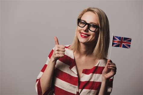 Premium Photo | Girl holds british flag