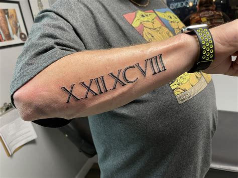Roman Numerals Tattoo Designs For Men