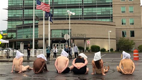 Daniel Prude: Naked protesters wear 'spit hoods' on 6th day of protest