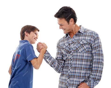 Premium Photo | Father arm wrestle and child with strength for game of
