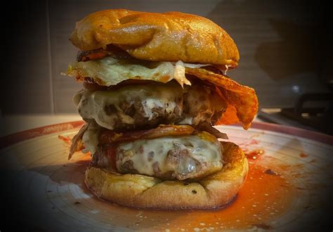 Big filthy burger: Two mustard-soaked beef patties, Jarlsberg cheese