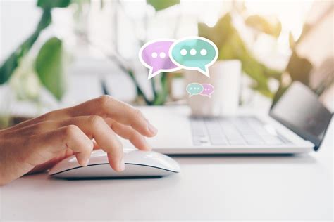 Hand typing on a keyboard with communication icons 2075607 Stock Photo