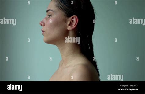 Female profile. Side view of a naked woman standing. The face of a ...