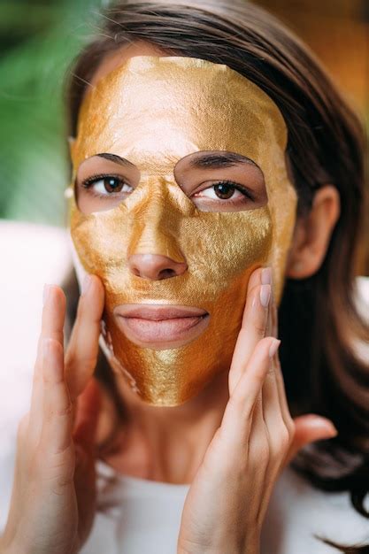 Premium Photo | Woman with gold face beauty mask