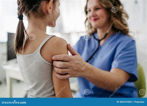 Orthopedist Examines the Spine, Posture, and Spinal Deformities of ...