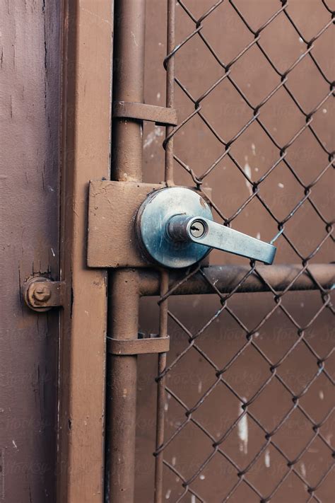 "Door And Lock On Building Exterior" by Stocksy Contributor "Rialto