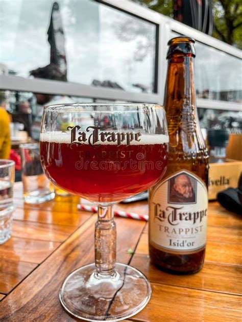 A Glass of La Trappe Trapist Beer on the Table Editorial Image - Image ...