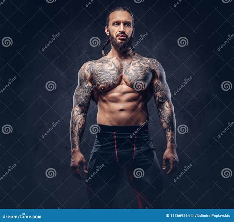 Muscular Naked Man And Female Hands Royalty-Free Stock Photography