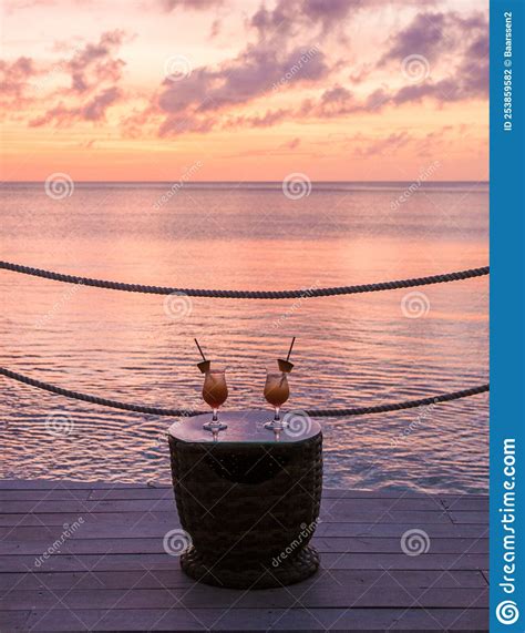Cocktails during Sunset on the Beach at the Tropical Beach of Saint