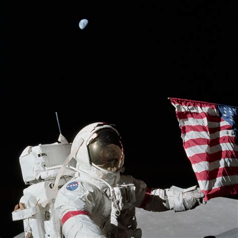 Apollo 17 Mission image - station Lunar Module LM, Flag, CDR, Earth