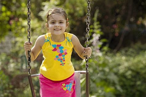 Girl Enjoying On A Swing Photo Background And Picture For Free Download
