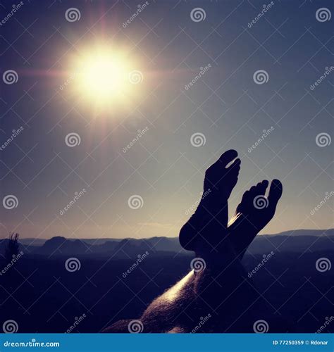 Naked Male Legs Take Rest on Peak. Outdoor Activities Stock Image
