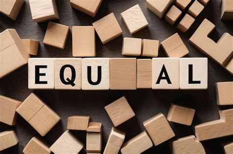 Premium Photo | Man made word EQUAL with wood blocks