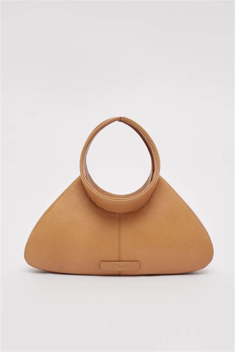 Discover the capsule collection DAM on our website. | Stylish leather ...