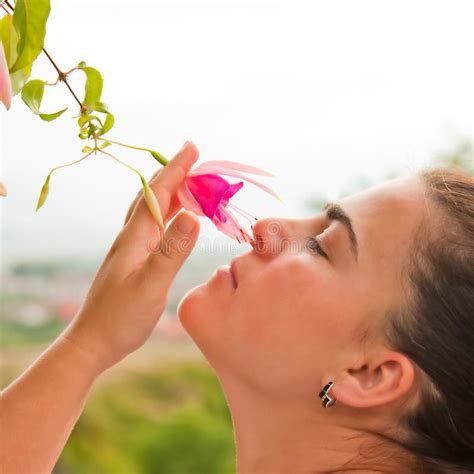 smelling flowers stock photo image   emotion