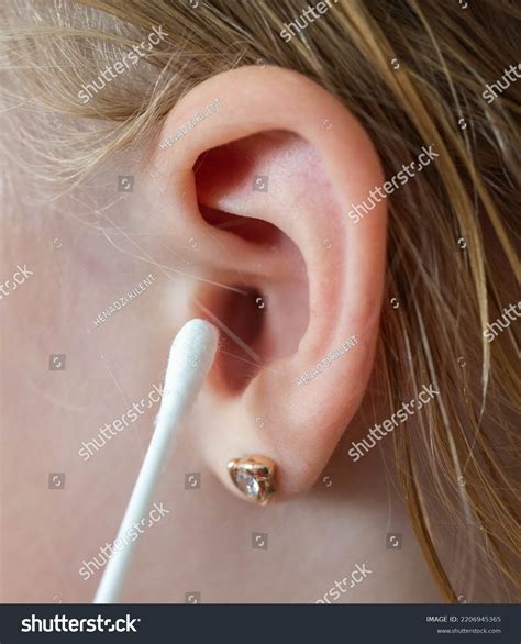 cleaning childs ear cotton swab contamination stock photo