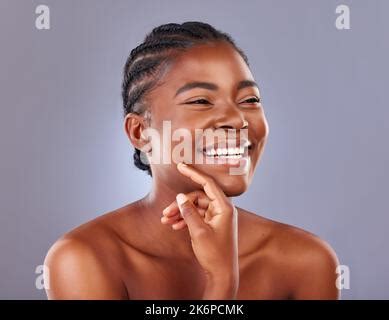 My skin feels amazingly soft. a beautiful young woman posing against a ...