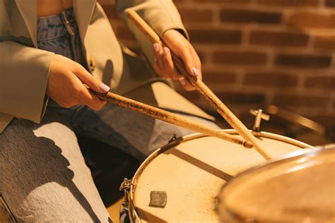 Close-up Photo of Brown Instrument With Blue Sticks · Free Stock Photo