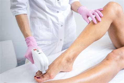 Laser Hair Removal on Women`s Legs . White Background Close Up Stock ...