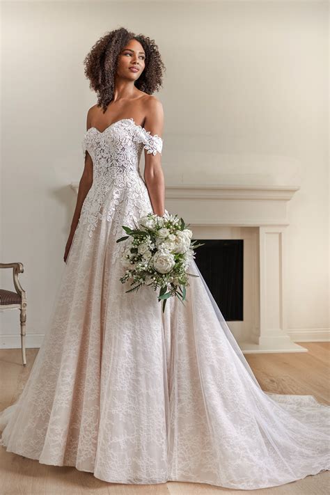 Cold shoulder a line wedding dress | Honestweddingadvice.com