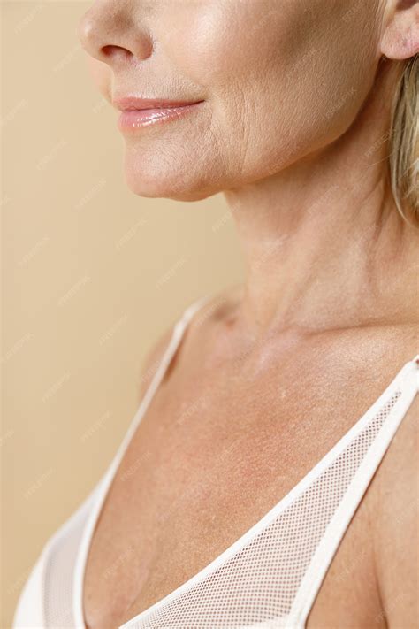 Premium Photo | Cropped shot of skin of mature blonde woman in white